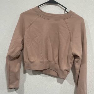 a cropped sweat shirt.